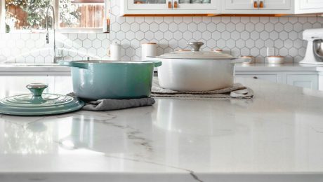 Close-up of quartz kitchen countertop with cookware in modern Florida home